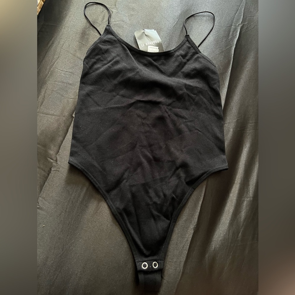 Black separat tank body suit .